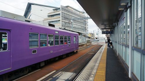 Train at railroad station in city