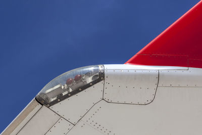 Airplane against clear blue sky