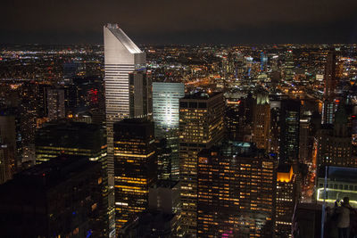 High angle view of illuminated city buildings at night