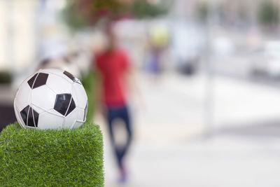 Close-up of soccer ball on grass