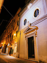 Low angle view of illuminated building at night