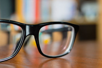 Close-up of eyeglasses on table at home