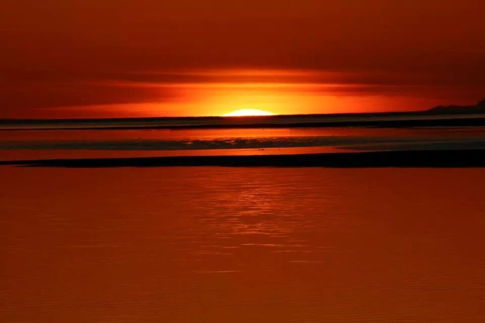 sunset, orange color, scenics, water, tranquil scene, beauty in nature, tranquility, sea, horizon over water, sky, idyllic, nature, reflection, beach, waterfront, sun, cloud - sky, remote, outdoors, rippled