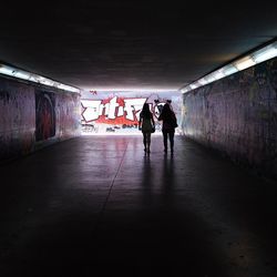 People walking in tunnel