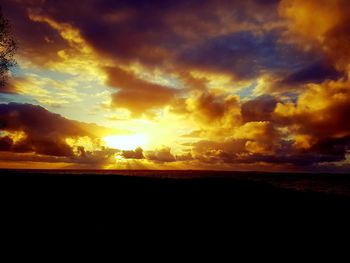 Scenic view of dramatic sky during sunset