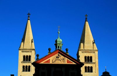 Low angle view of church against blue sky