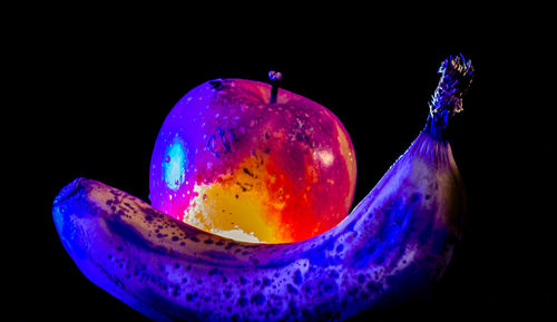 Close-up of apple against black background