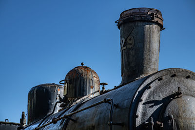 Steam train against clear blue sky