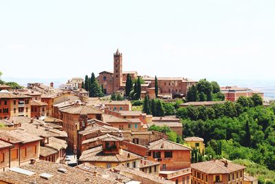 View of buildings in city against clear sky