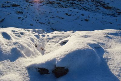 High angle view of snow on shore