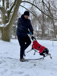 Man with dog on snow