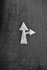 Arrow sign on road