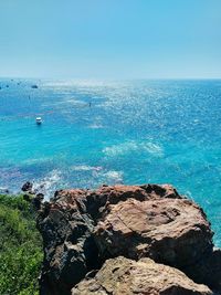 Scenic view of sea against clear blue sky