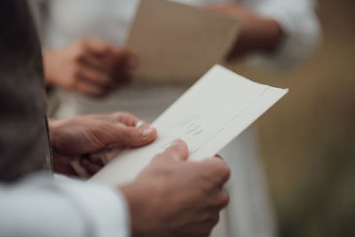 Close-up of woman hand holding paper