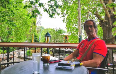 Portrait of man sitting at cafe