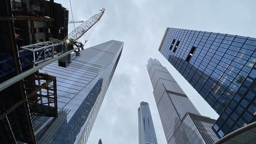 Low angle view of modern buildings against sky