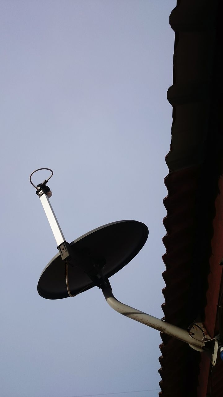 LOW ANGLE VIEW OF STREET LIGHT BY BUILDING AGAINST SKY