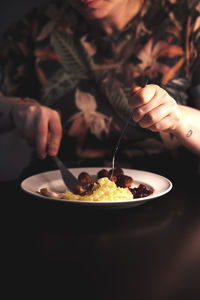 Close-up of hand holding ice cream