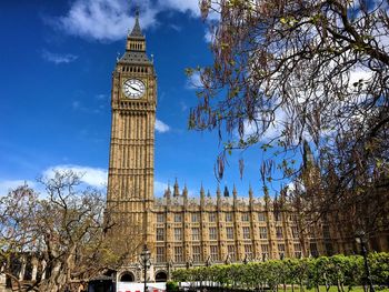 Low angle view of clock tower against sky