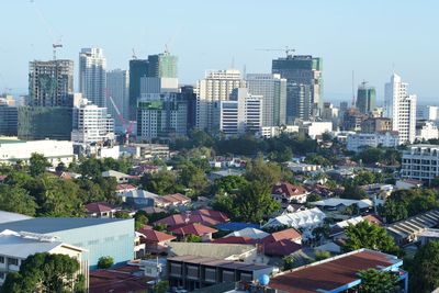 High angle view of buildings in city against sky