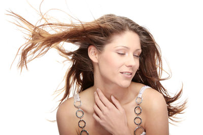 Portrait of a beautiful young woman over white background