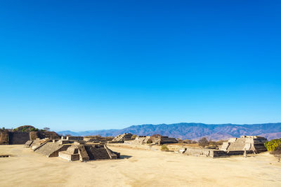 Panoramic view of landscape against blue sky