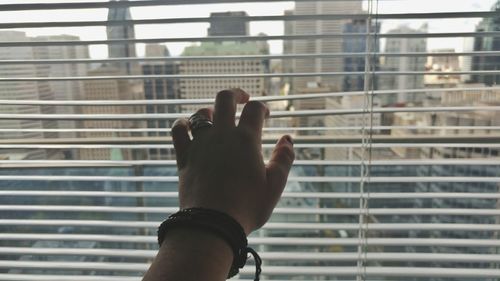 Close-up of hand on finger against blurred background