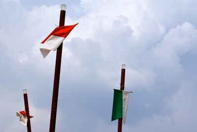 Low angle view of flag against sky