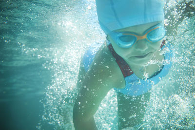 Man swimming in pool