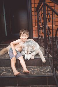 Portrait of young woman with cat