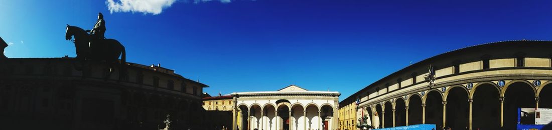 Low angle view of building against clear blue sky