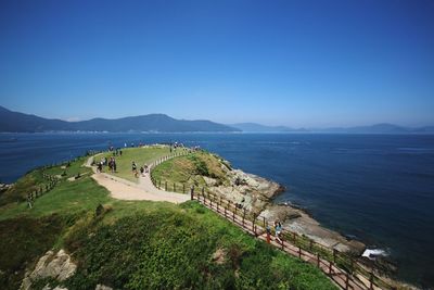 Scenic view of sea against blue sky