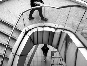High angle view of woman walking on steps