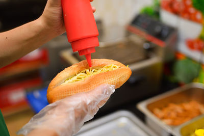Close-up of hand holding burger
