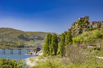 Scenic view of sea against clear blue sky