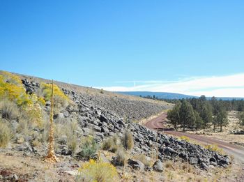 Scenic view of landscape against clear blue sky