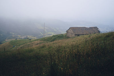 House on field against sky