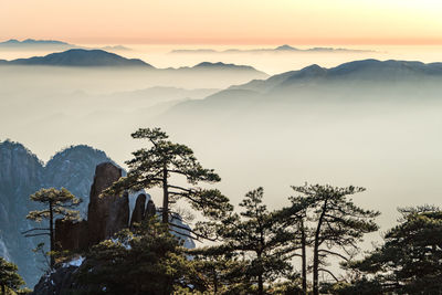 Scenic view of mountains against sky during sunset