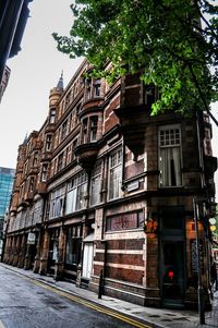 Street by building against sky