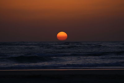 Scenic view of sea at sunset