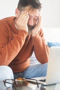 Young woman using laptop at home