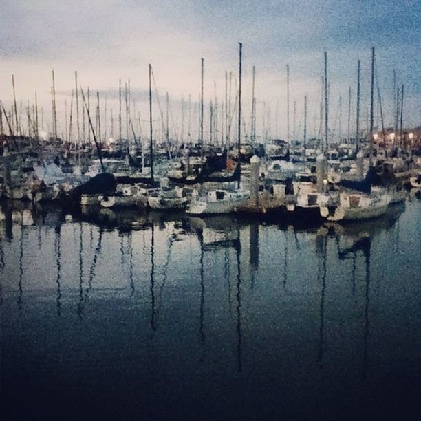 water, nautical vessel, moored, boat, transportation, mode of transport, reflection, harbor, sky, sea, waterfront, tranquility, lake, tranquil scene, mast, sailboat, nature, outdoors, no people, calm