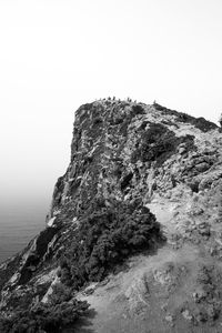 Low angle view of rock formations against sky