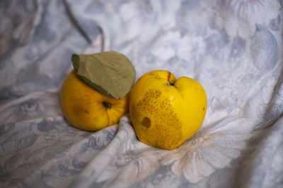 Close-up of apple on bed