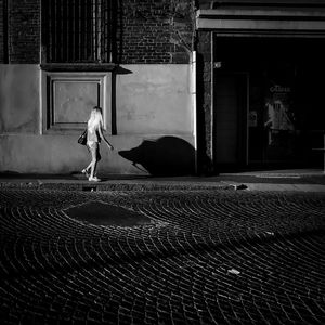 Woman in front of building