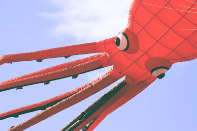 Flying kite with red octopus-shaped animal