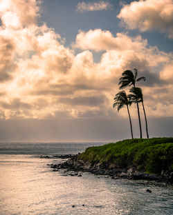 Scenic view of sea against sky at sunset