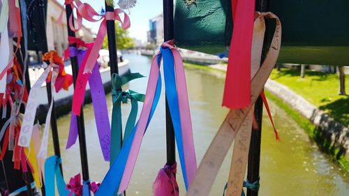 Close-up of multi colored flags hanging in water