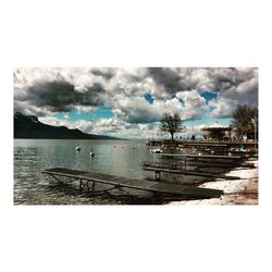 Scenic view of sea against cloudy sky