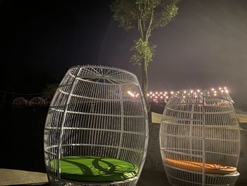 Close-up of illuminated lighting equipment on table at night